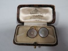 A PAIR OF 9CT GOLD AND PLATINUM STUDS IN ORIGINAL BOX