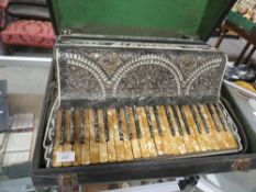 A CASED SETTIMIO SOPRANI CASTELLO ACCORDION WITH EXTENSIVE DECORATION