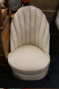A VINTAGE UPHOLSTERED BEDROOM CHAIR