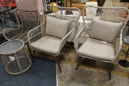 THREE MODERN RATTAN EFFECT GARDEN CHAIRS WITH A CIRCULAR GLASS TOPPED TABLE