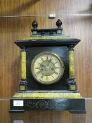A VINTAGE CASED WOODEN MANTLE CLOCK