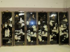 A SET OF SIX LACQUERED BLACK ORIENTAL WALL PANELS