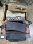 A CAMCORDER TOGETHER WITH A VINTAGE RADIO