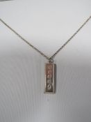A MENS VINTAGE 1 oz SILVER INGOT ON A SILVER CHAIN