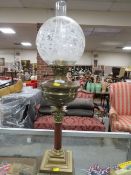 A VINTAGE OIL LAMP WITH TWIN BURNER AND DECORATIVE ETCHED GLASSED SHADE