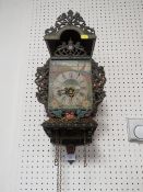 A VINTAGE FRISIAN CHAIR CLOCK WITH TWIN WEIGHTS AND PENDULUM