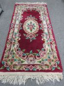 A SMALL CHINESE RUG TOGETHER WITH ORIGINAL TIMES NEWSPAPER FROM JULY 1925 WITH CERTIFICATE OF