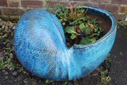 A LARGE CERAMIC SNAIL STYLE PLANTER