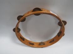 A NEW ERA VINTAGE WOODEN TAMBOURINE