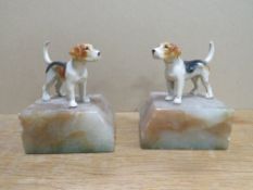 A PAIR OF FOX HOUNDS ON MARBLE BASES