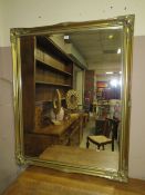 A LARGE MODERN GILT FRAMED RECTANGULAR MIRROR 127 x 105 cm