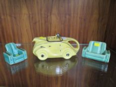 A VINTAGE SADLER RACING CAR TEAPOT IN YELLOW, TOGETHER WITH TWO SIMILAR STYLE SOFAS (3)