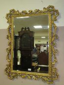 A VINTAGE GILT FRAMED AND PIERCED RECTANGULAR WALL MIRROR 99 x 73 cm