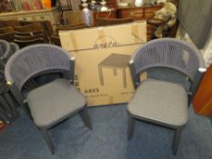 FIVE MODERN STACKING PATIO CHAIRS WITH A BOXED 'ARES' TABLE