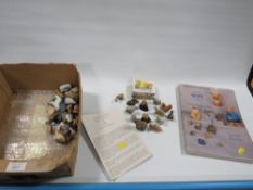 A SMALL COLLECTION OF WADE ANIMAL FIGURES TOGETHER WITH THE WORLD OF WADE COLLECTORS BOOK