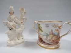 A STAFFORDSHIRE FLATBACK FIGURE A/F TOGETHER WITH A LARGE HAND PAINTED TWIN HANDLED LOVING CUP