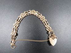 A HALLMARKED 9CT GOLD GATE BRACELET approx weight 9g