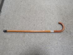 A MALACCA WALKING STICK WITH HALLMARKED SILVER BANDING