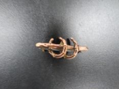 A HALLMARKED 9 CARAT GOLD DOUBLE HORSESHOE BROOCH approx weigh 2.5g