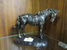 A CAST METAL FIGURE OF A HORSE