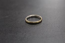 A GOLD PLATED BAND STAMPED PLAT