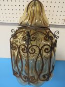 A GLASS AND BENT IRON WORK LIGHT FITTING