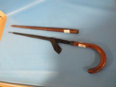 AN UNUSUAL EDWARDIAN WALKING STICK UMBRELLA