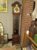 A MODERN TRIPLE OAK LONGCASE CLOCK