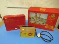A TRI-ANG RAILWAYS R1X PASSENGER TRAIN SET TOGETHER WITH A BOXED OPERATING ROYAL MAIL COACH SET