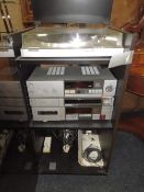 A RETRO AKAI STACKING STEREO SYSTEM IN CABINET - HOUSE CLEARANCE