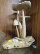 A WOODEN MUSHROOM DISPLAY