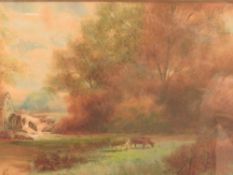 A FRAMED AND GLAZED WATERCOLOUR OF COWS GRAZING IN A FIELD, WATER MILL AND TREES BEYOND SIGNED F.