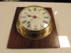 A MARINE STYLE WALLCLOCK ON BOARD