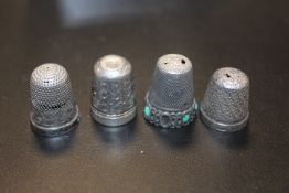 A CHESTER HALLMARKED SILVER CHARLES HORNER THIMBLE, TOGETHER WITH ANOTHER SILVER EXAMPLE AND TWO
