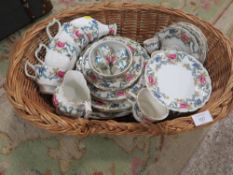 A BASKET CONTAINING A TRAY OF BOOTHS FLORADORA TEA/DINNER WARE