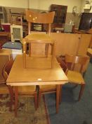A MID CENTURY 'E GOMME FOR G-PLAN' SMALL DINING TABLE AND FOUR CHAIRS