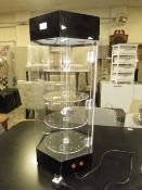A ROTATING TABLE TOP DISPLAY CABINET