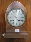 AN INLAID DOMED MANTLE CLOCK WITH KEY AND PENDULUM