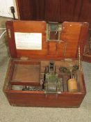 A VINTAGE WOODEN AND BRASS COUNTER TILL