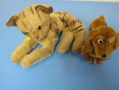 A STEIFF DACHSHUND TOGETHER WITH A STEIFF BABY TIGER (NO LABELS BUT BUTTONS IN EARS )