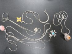 FIVE MODERN SILVER AND OTHER PENDANTS ON CHAINS