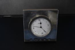 A HALLMARKED SILVER DESK CLOCK (CLOCK LOOSE)