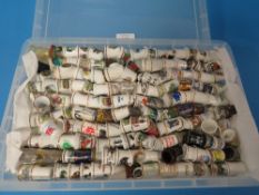 A BOX CONTAINING OVER 300 THIMBLES