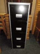 A METAL FOUR DRAWER FILING CABINET