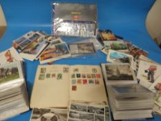 A TRAY OF VINTAGE POSTCARDS. STAMP ALBUM ETC