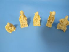 FIVE CHINESE TYPE SMALL CARVED BONE FIGURES