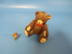 A JOINTED PORCELAIN MINIATURE STEIFF TEDDY BEAR LICENSE EC99 # 53813 TOGETHER WITH A STEIFF