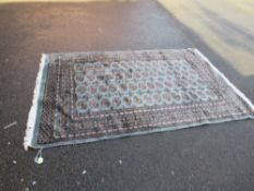 A VINTAGE WOOLLEN RUG - 240 x 156 cm