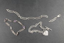 A 925 HEART DETAILED BRACELET TOGETHER WITH A 925 PURPLE STONE SET BRACELET AND ANOTHER (3)