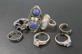A COLLECTION OF SILVER AND WHITE METAL DRESS RINGS